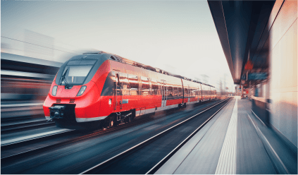 A high-speed train swiftly travels along the tracks, showcasing modern transportation technology in motion.